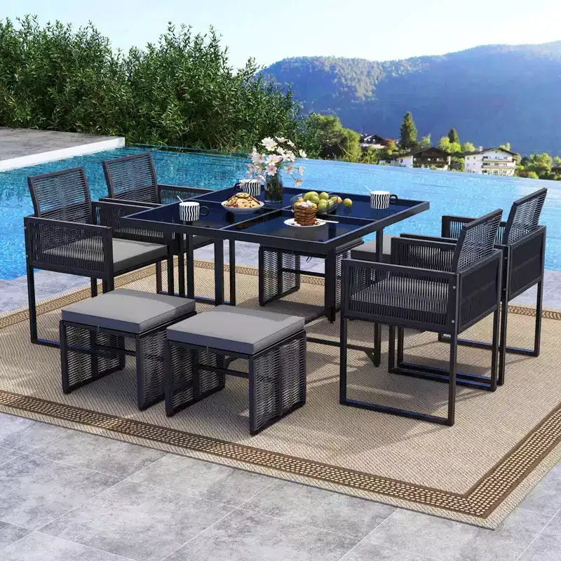 Costway 9 PCS Patio Dining Set with PE Rattan Chairs Tempered Glass Table and Ottomans
