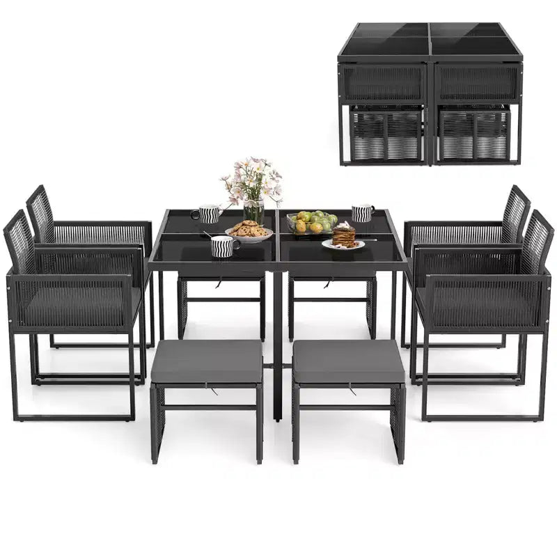 Set da pranzo da patio Costway da 9 pezzi con sedie in rattan PE, tavolo in vetro temperato e pouf