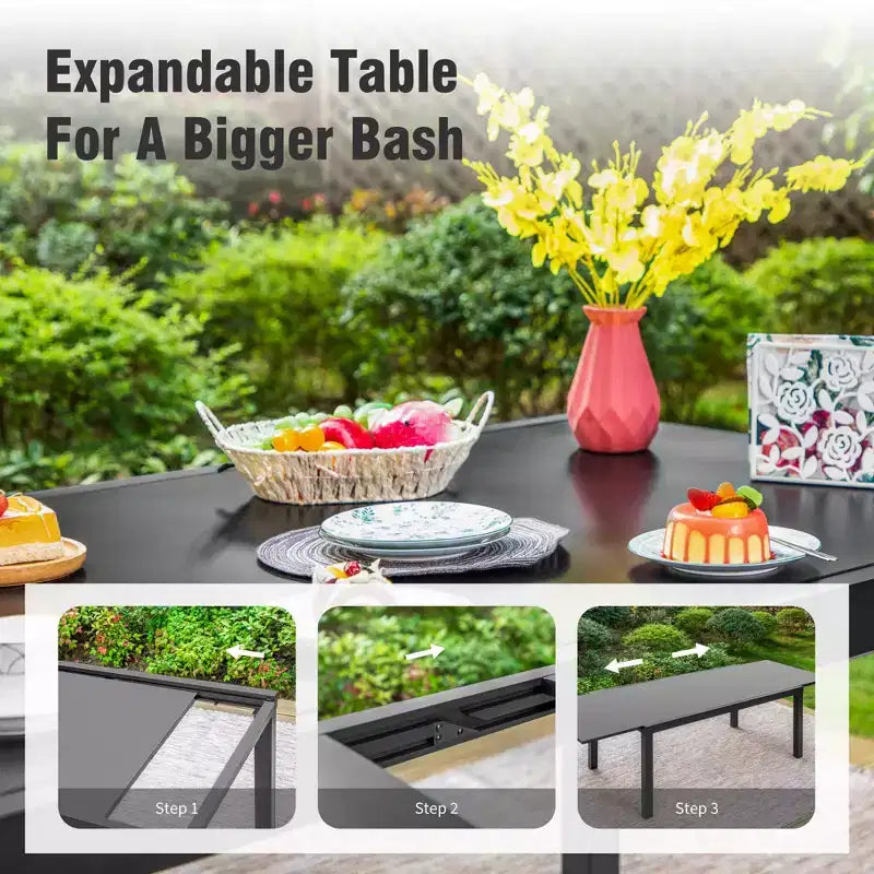 Mesa de comedor extensible de acero para patio exterior Captiva Designs de 9 piezas y sillas de ratán con brazos en forma de media luna